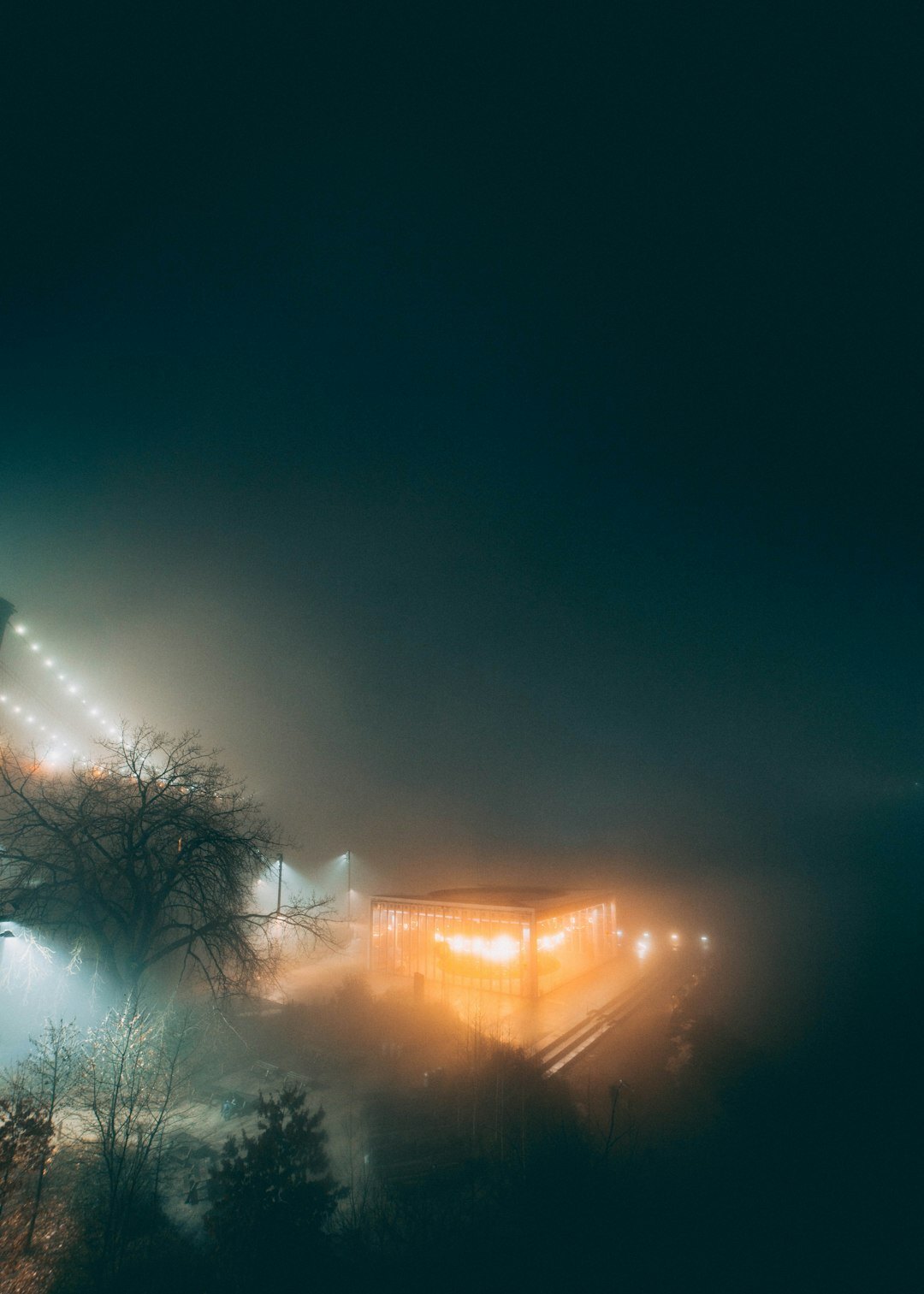 small town at night with fog